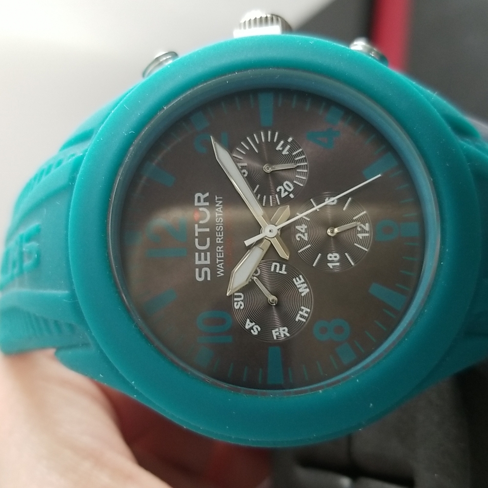 Sector men watch.  Green rubber band.  New with tag and original box.